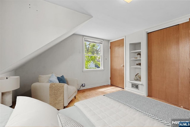 9 Rutan Pl, Bloomfield, NJ 07003 - bedroom featuring light wood finished floors and two closets