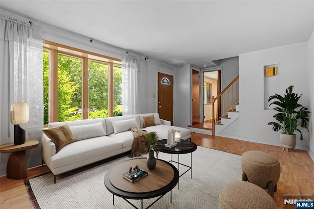9 Rutan Pl, Bloomfield, NJ 07003 - living room with stairs and light wood finished floors