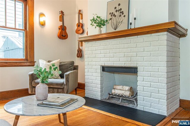 27 Nassau Rd, Montclair, NJ 07043 - living room with wood finished floors and a fireplace