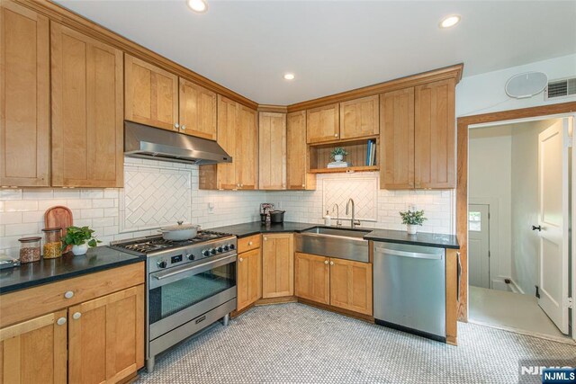 27 Nassau Rd, Montclair, NJ 07043 - kitchen with appliances with stainless steel finishes, under cabinet range hood, a sink, dark countertops, and recessed lighting