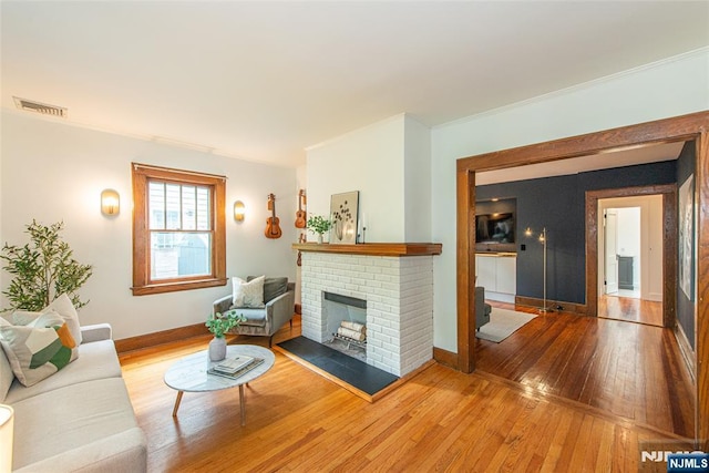 27 Nassau Rd, Montclair, NJ 07043 - living area with hardwood / wood-style flooring, ornamental molding, a fireplace, and baseboards