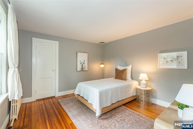 27 Nassau Rd, Montclair, NJ 07043 - bedroom with wood-type flooring and baseboards