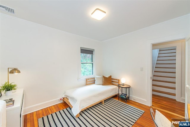 27 Nassau Rd, Montclair, NJ 07043 - bedroom with ornamental molding, light wood finished floors, and baseboards