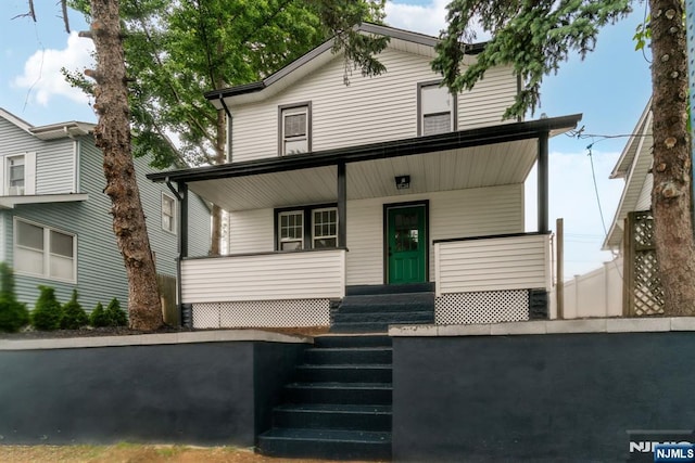 34 Emerald St, Hackensack, NJ 07601 - view of front of property featuring covered porch and stairs
