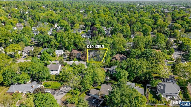 12 Louise Ln, Tenafly, NJ 07670 - aerial perspective of suburban area with property parcel outlined and a heavily wooded area