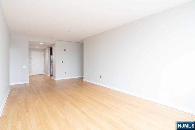 812 Hudson Park Unit 812, Edgewater, NJ 07020 - empty room featuring light wood finished floors and baseboards