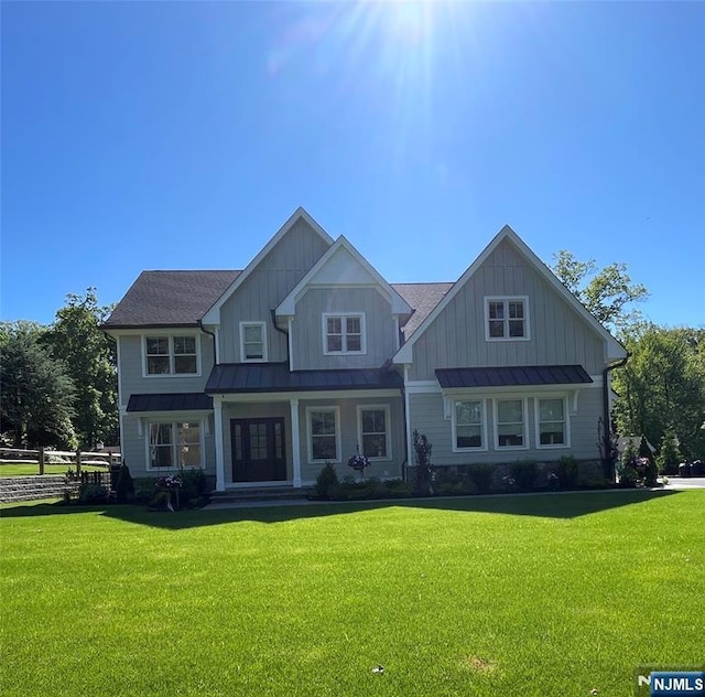 36 Woodmont Rd, Montville Township, NJ 07058 - view of front facade with a standing seam roof, metal roof, and board and batten siding
