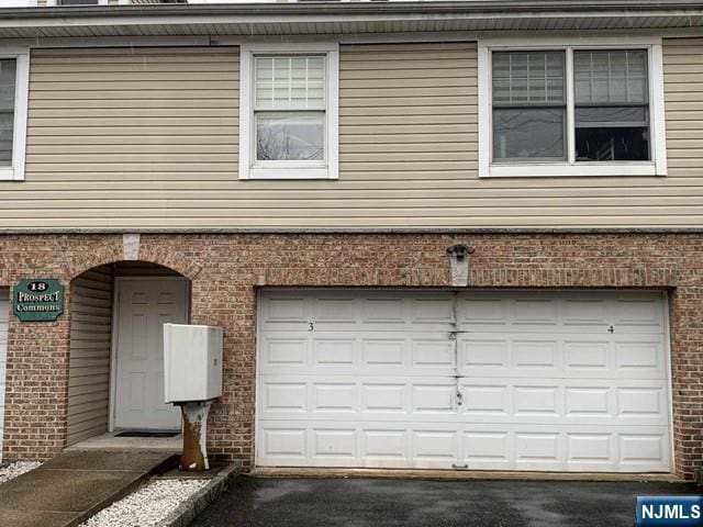 18 Prospect St Unit 4, Palisades Park, NJ 07650 - garage featuring asphalt driveway