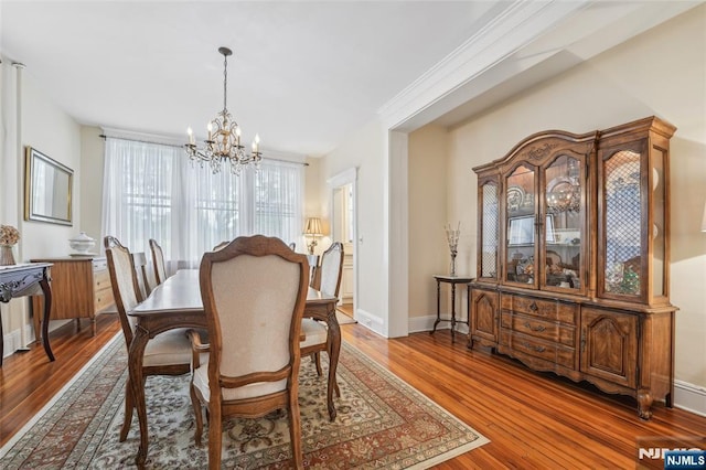 74 Oakdene Ave, Cliffside Park, NJ 07010 - dining space with a chandelier, hardwood / wood-style floors, and baseboards