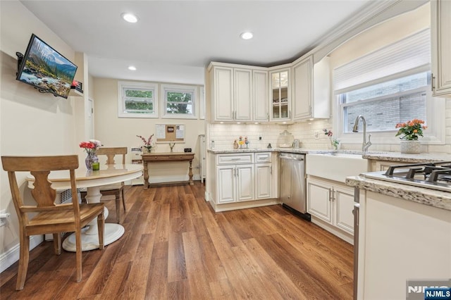 74 Oakdene Ave, Cliffside Park, NJ 07010 - kitchen with stainless steel dishwasher, light wood-type flooring, tasteful backsplash, recessed lighting, and light stone counters