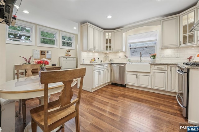 74 Oakdene Ave, Cliffside Park, NJ 07010 - kitchen with appliances with stainless steel finishes, a sink, light wood-style floors, decorative backsplash, and recessed lighting