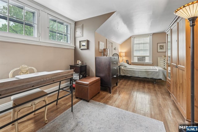 74 Oakdene Ave, Cliffside Park, NJ 07010 - bedroom with hardwood / wood-style flooring, lofted ceiling, and cooling unit