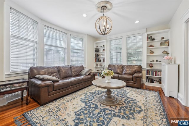 74 Oakdene Ave, Cliffside Park, NJ 07010 - living area featuring a chandelier, wood finished floors, built in shelves, and recessed lighting