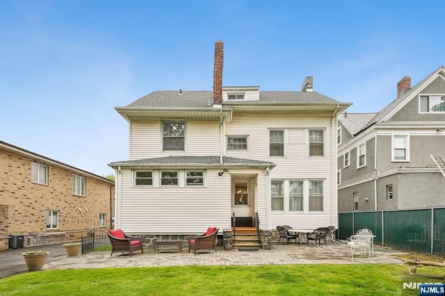 74 Oakdene Ave, Cliffside Park, NJ 07010 - rear view of property featuring entry steps, a patio area, central AC, an outdoor living space, and a chimney