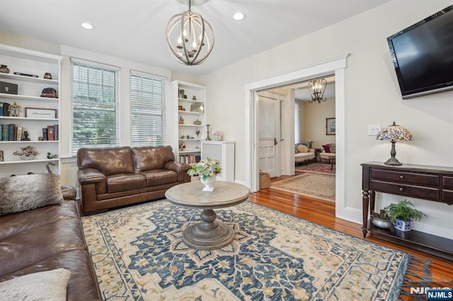 74 Oakdene Ave, Cliffside Park, NJ 07010 - living room with a chandelier, wood finished floors, and recessed lighting