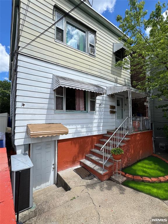 68 Jewell St, Garfield, NJ 07026 - view of front facade with central AC