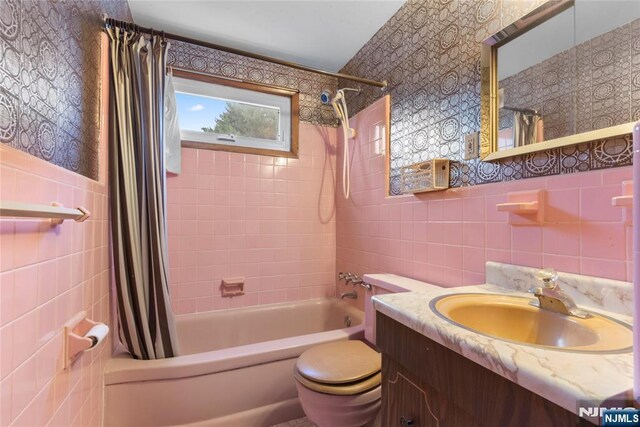 3 Gregory Ter, Belleville, NJ 07109 - bathroom with tile walls, shower / bath combination with curtain, toilet, and vanity