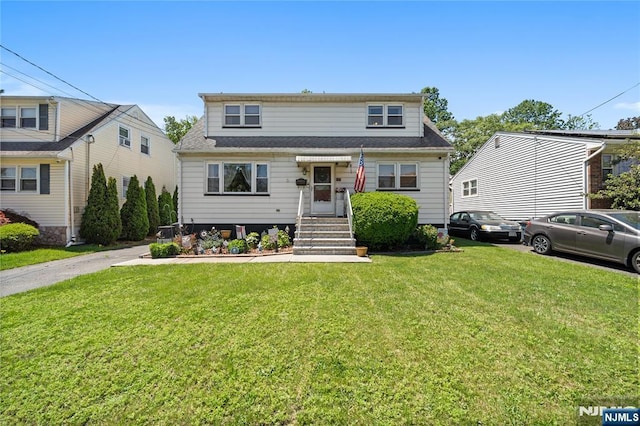 117 Wabash Ave, Clifton, NJ 07011 - view of front facade featuring a front yard and a shingled roof