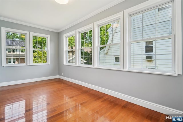 217 Grayson Pl, Teaneck, NJ 07666 - spare room with baseboards, wood finished floors, and crown molding