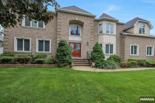 245 Forest Ave, Emerson, NJ 07630 - view of front of house with entry steps, a front lawn, and brick siding