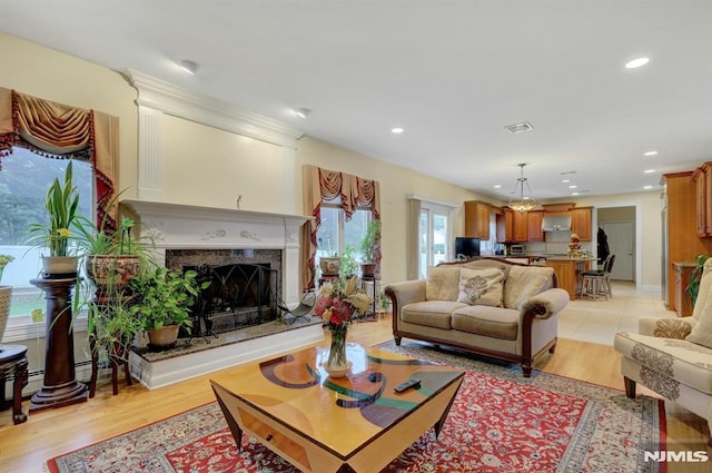 245 Forest Ave, Emerson, NJ 07630 - living area featuring a high end fireplace, recessed lighting, and light wood-style floors