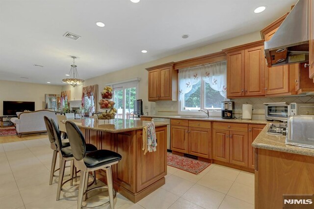 245 Forest Ave, Emerson, NJ 07630 - kitchen with range hood, a sink, stainless steel appliances, backsplash, and recessed lighting