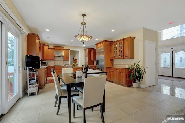 245 Forest Ave, Emerson, NJ 07630 - dining area with recessed lighting, light tile patterned floors, and baseboards