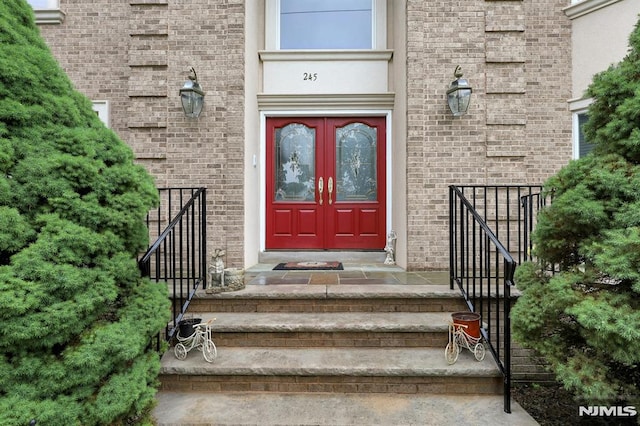 245 Forest Ave, Emerson, NJ 07630 - view of exterior entry with french doors and brick siding