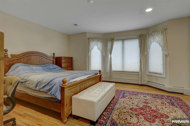 245 Forest Ave, Emerson, NJ 07630 - bedroom with wood finished floors, recessed lighting, and baseboard heating