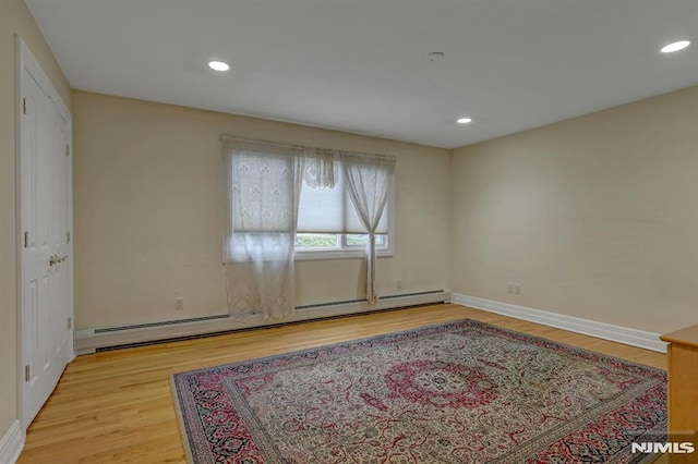 245 Forest Ave, Emerson, NJ 07630 - spare room with a baseboard radiator, light wood finished floors, recessed lighting, and baseboards