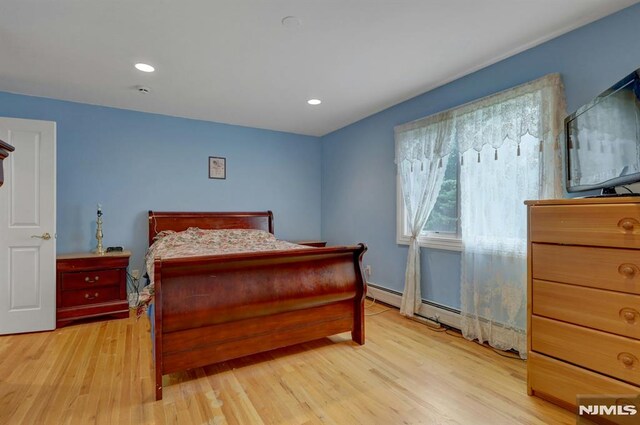 245 Forest Ave, Emerson, NJ 07630 - bedroom featuring light wood finished floors, recessed lighting, baseboards, and baseboard heating