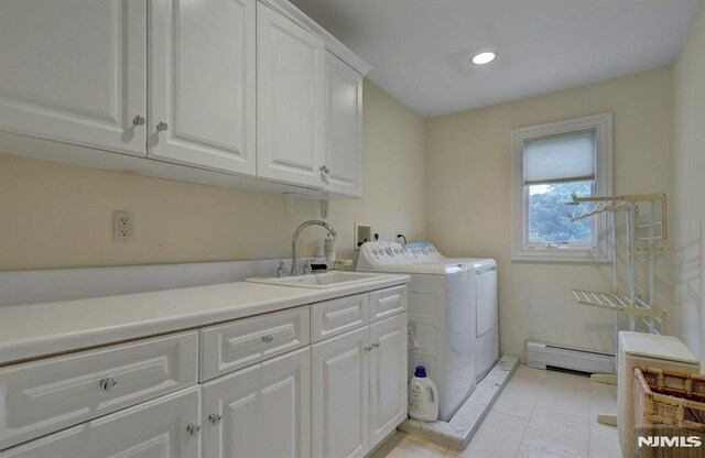 245 Forest Ave, Emerson, NJ 07630 - washroom featuring cabinet space, baseboard heating, separate washer and dryer, light tile patterned flooring, and recessed lighting