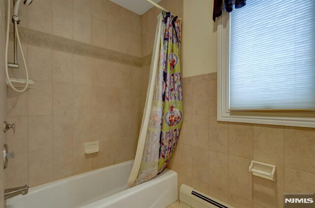 245 Forest Ave, Emerson, NJ 07630 - bathroom featuring shower / tub combo and tile walls