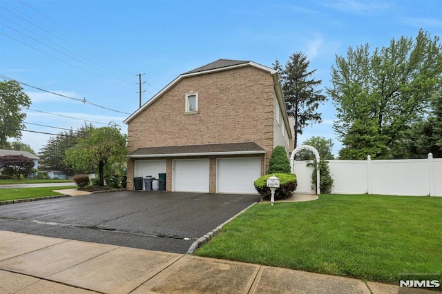 245 Forest Ave, Emerson, NJ 07630 - view of property exterior with brick siding, a garage, and asphalt driveway