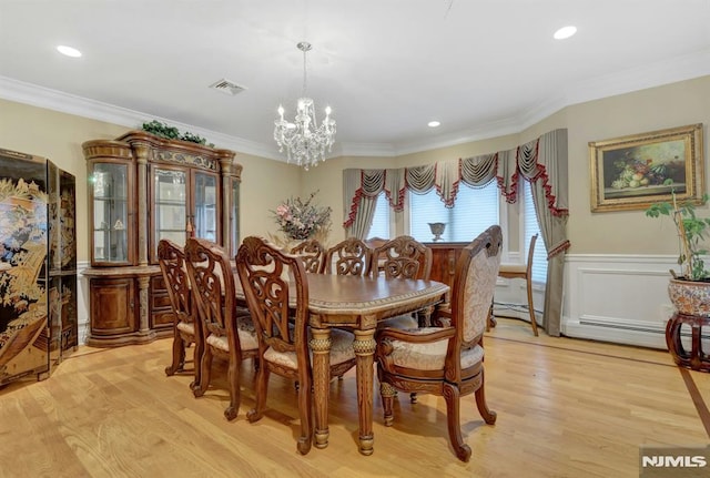 245 Forest Ave, Emerson, NJ 07630 - dining space with ornamental molding, a wainscoted wall, light wood-style floors, a chandelier, and recessed lighting