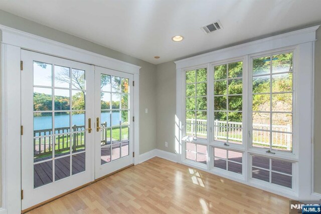 1 Brook Valley Ter, Kinnelon Borough, NJ 07405 - doorway featuring a water view, french doors, light wood-style floors, baseboards, and recessed lighting