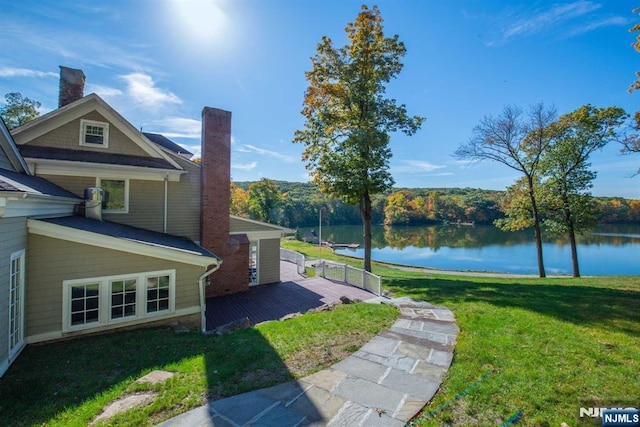 1 Brook Valley Ter, Kinnelon Borough, NJ 07405 - view of grassy yard with a deck with water view