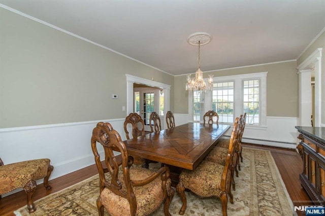 1 Brook Valley Ter, Kinnelon Borough, NJ 07405 - dining space with a baseboard heating unit, dark wood-type flooring, a chandelier, french doors, and crown molding