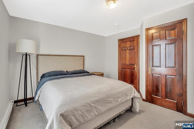 77 Myrtle Ave, Allendale, NJ 07401 - bedroom with a baseboard heating unit, light colored carpet, and baseboards