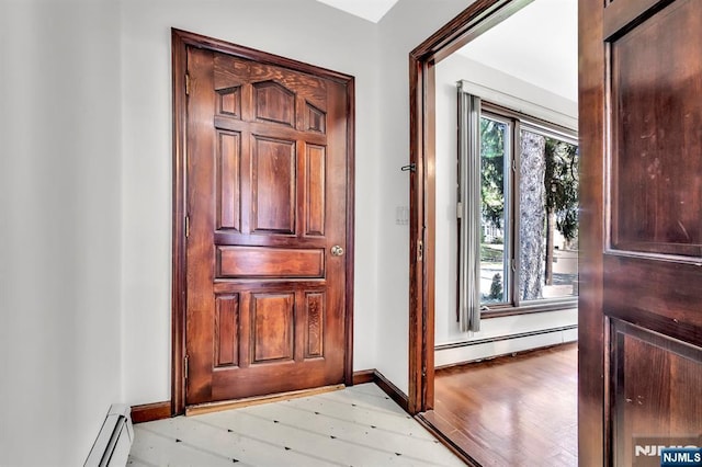 77 Myrtle Ave, Allendale, NJ 07401 - foyer featuring light wood-style flooring, a baseboard heating unit, and baseboards