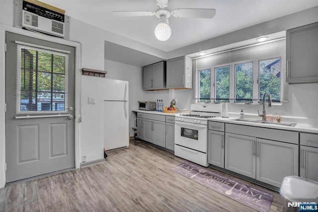 77 Myrtle Ave, Allendale, NJ 07401 - kitchen featuring gray cabinetry, white appliances, a sink, and healthy amount of natural light