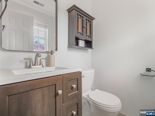 3106 Tudor Dr, Pequannock Township, NJ 07444 - half bath featuring toilet, vanity, and ornamental molding