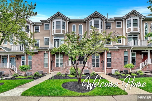 274 Roslyn Ct, West New York, NJ 07093 - townhome / multi-family property with central AC unit and brick siding