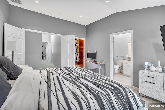 274 Roslyn Ct, West New York, NJ 07093 - bedroom with a walk in closet, vaulted ceiling, a closet, light carpet, and baseboards
