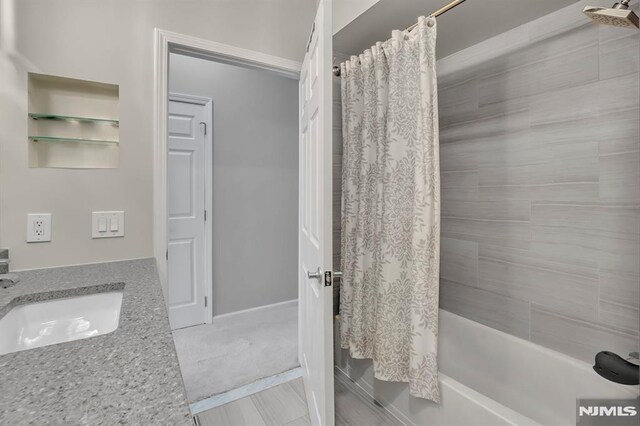 274 Roslyn Ct, West New York, NJ 07093 - bathroom with shower / bathtub combination with curtain and vanity