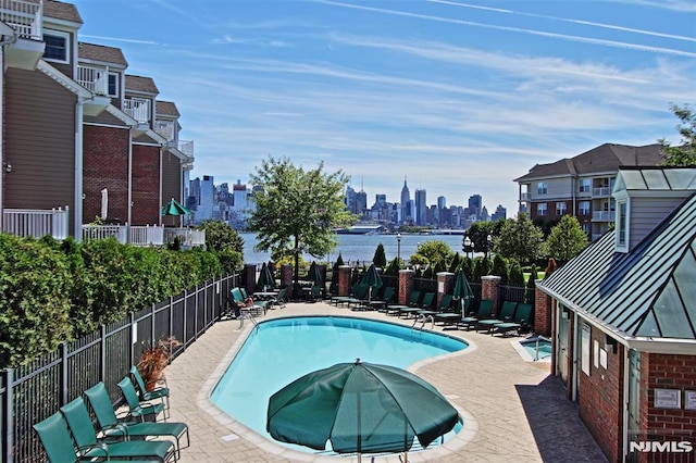 274 Roslyn Ct, West New York, NJ 07093 - community pool featuring a view of skyline and a patio area
