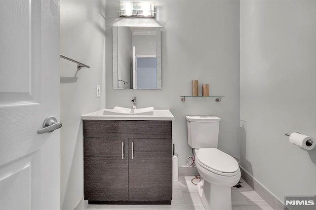 274 Roslyn Ct, West New York, NJ 07093 - half bathroom with toilet, vanity, and baseboards