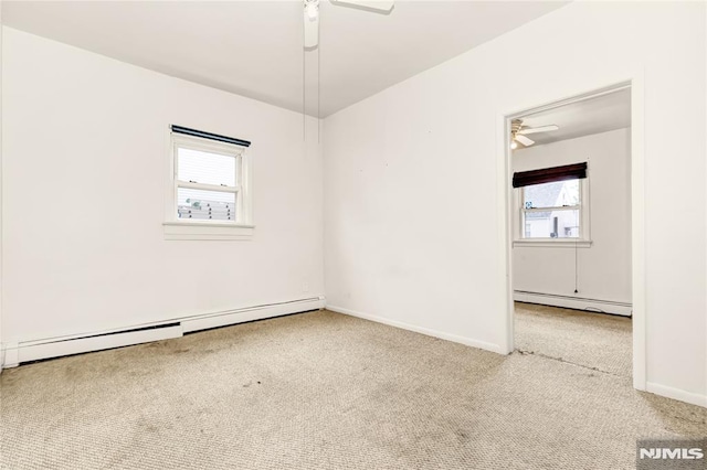 89 Westminster Pl, Garfield, NJ 07026 - carpeted empty room featuring a ceiling fan, a baseboard heating unit, and baseboards