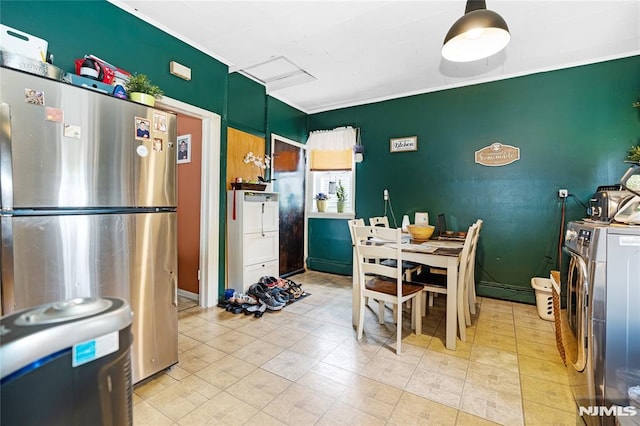 89 Westminster Pl, Garfield, NJ 07026 - dining area featuring washer / clothes dryer, an accent wall, and baseboards