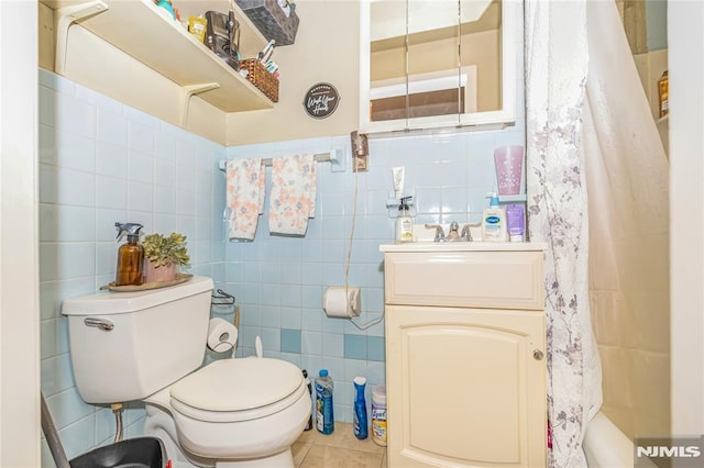 89 Westminster Pl, Garfield, NJ 07026 - full bath with tile walls, toilet, vanity, tile patterned flooring, and a shower with curtain